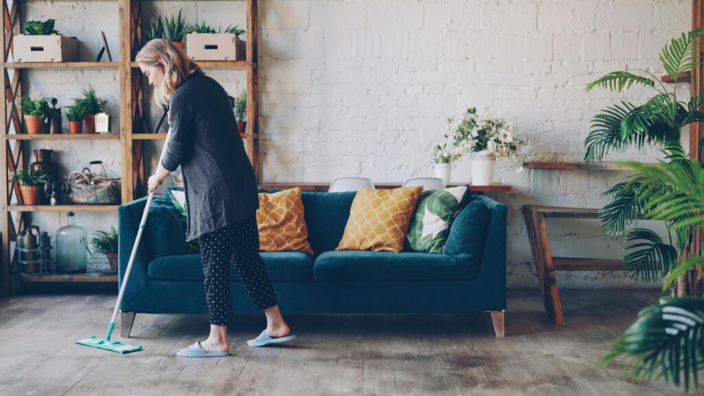 housemate cleaning living room