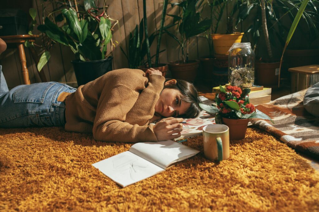 housemate sad on floor of bedroom