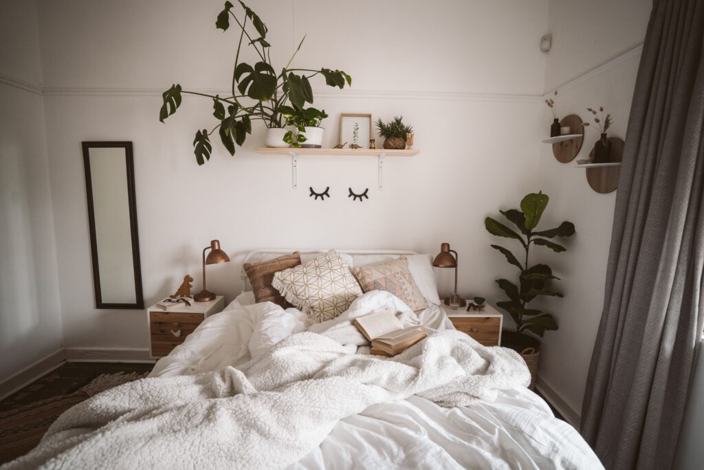 Cozy bedroom with plants providing inspiration for renter-friendly bedroom ideas