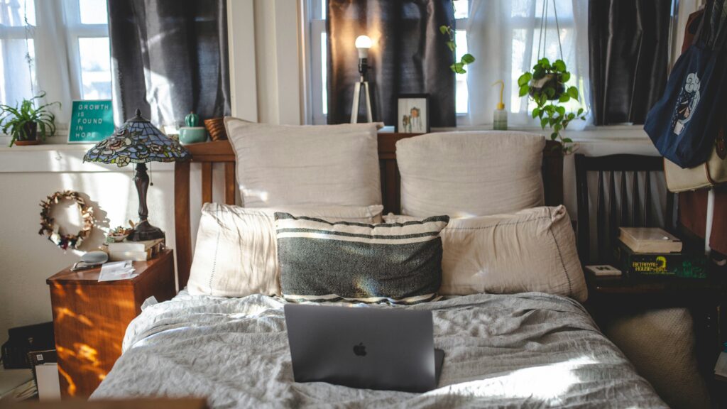 cozy bedroom with cushions and blanket